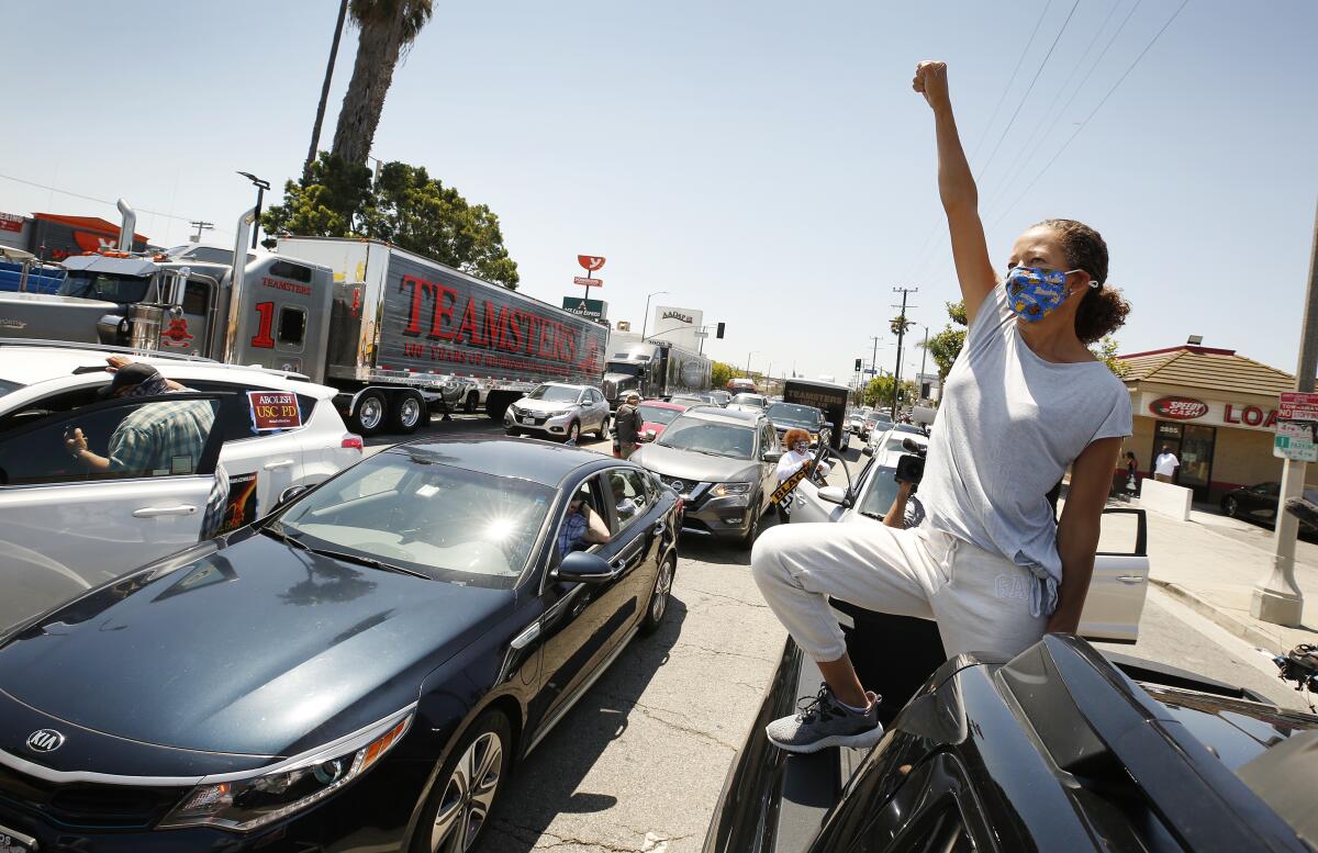 Vehicles block Crenshaw Boulevard in Los Angeles