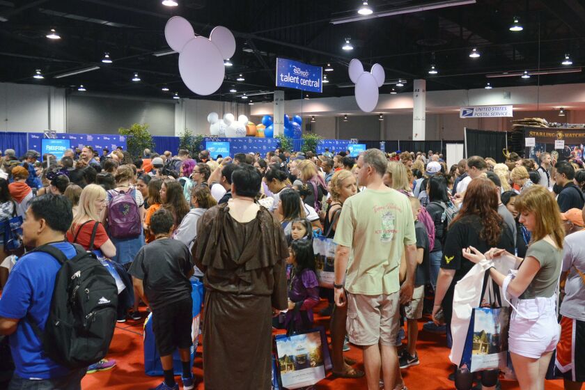 Disney fans fill the D23 Expo show floor at the Anaheim Convention Center on July 14 in search of panels, stores with exclusive merchandise and celebrity-sighting opportunities.