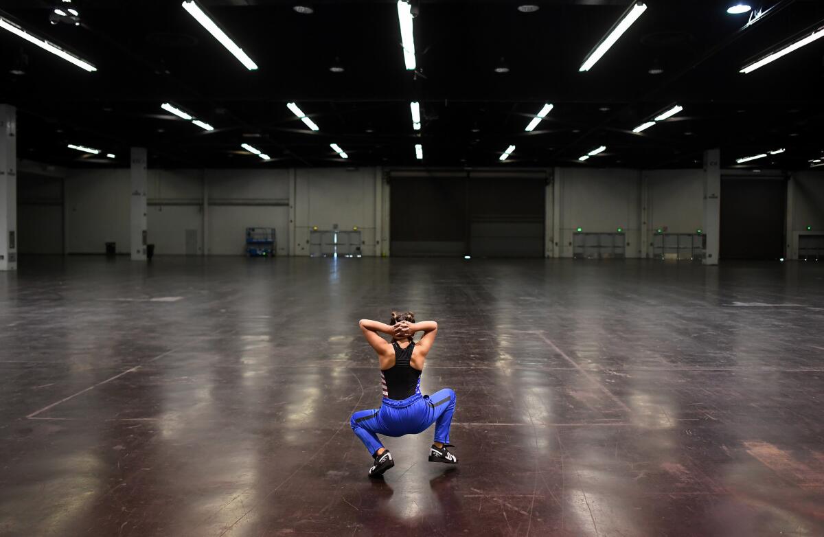 Penelope Meyers, 11, warms-up before competition in the under 13 year-old category at the Anaheim Convention Center. (Wally Skalij / Los Angeles Times)