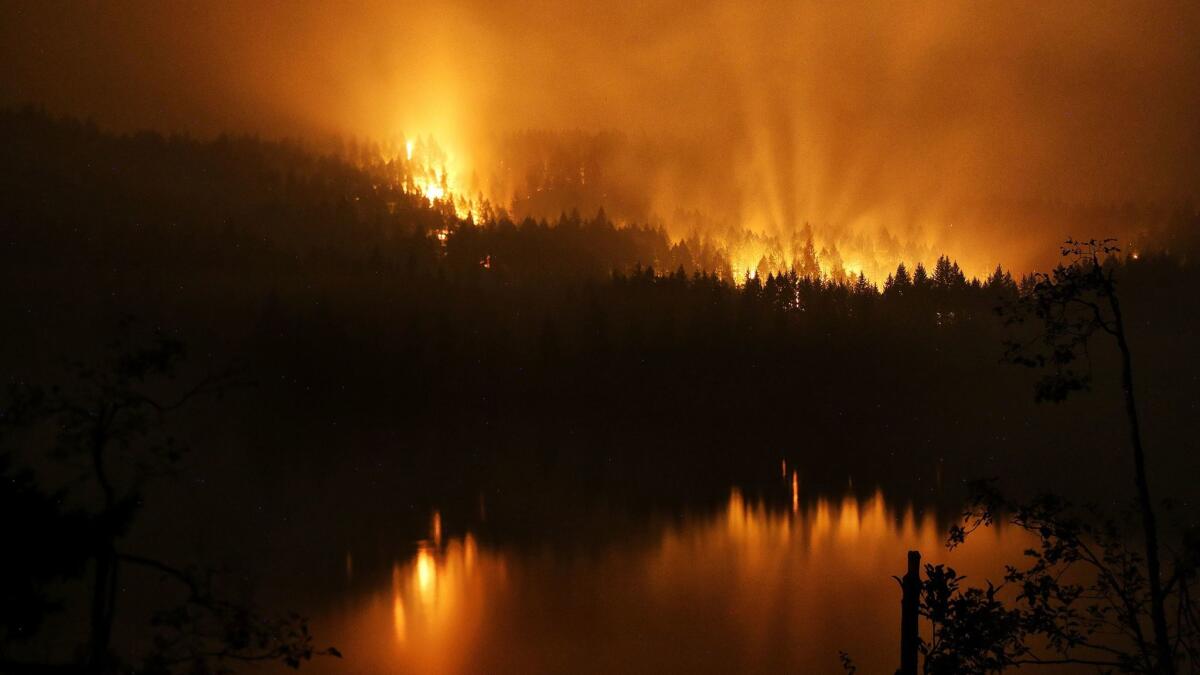 The Eagle Creek fire burns along the Oregon side of the Columbia River Gorge near Cascade Locks, Ore.
