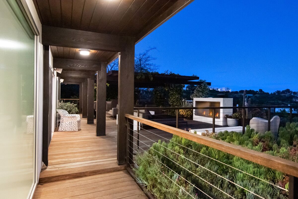 Two levels of decking take in city to ocean views.