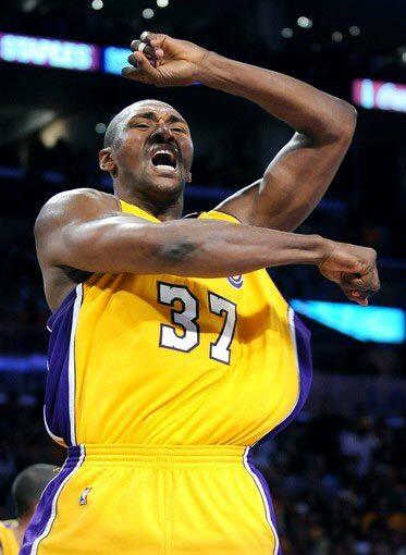 Lakers forward Ron Artest, who finished with 15 points, celebrates after blocking a shot by Celtics power forward Glen Davis in the fourth quarter of Game 1 on Thursday night.