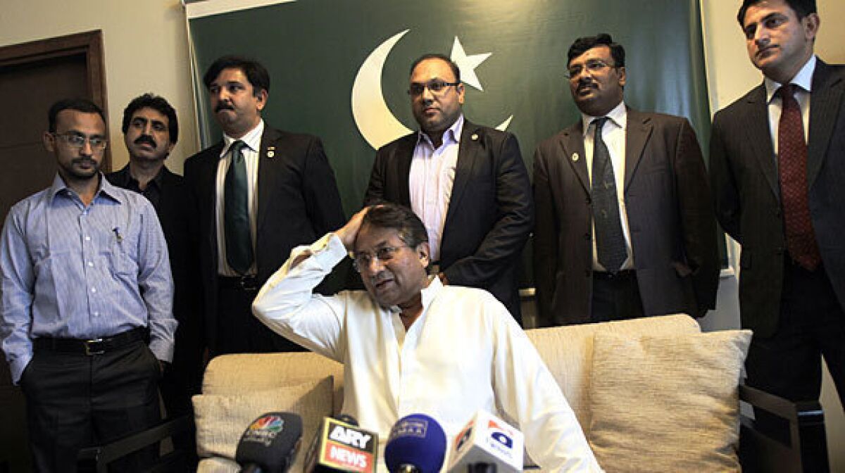 Former Pakistani President Pervez Musharraf talks to journalists in his office in Dubai before leaving for Pakistan.