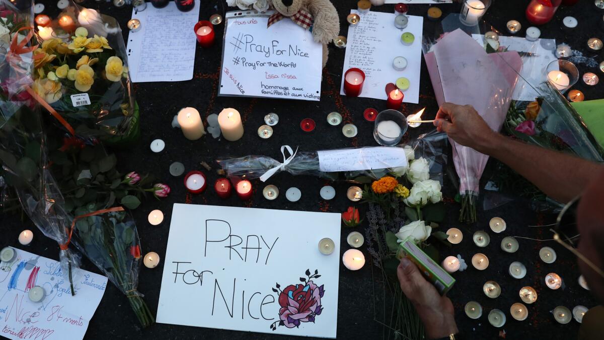 Tributes are left on the Promenade des Anglais in Nice, France, the night after an attack that killed and wounded dozens.