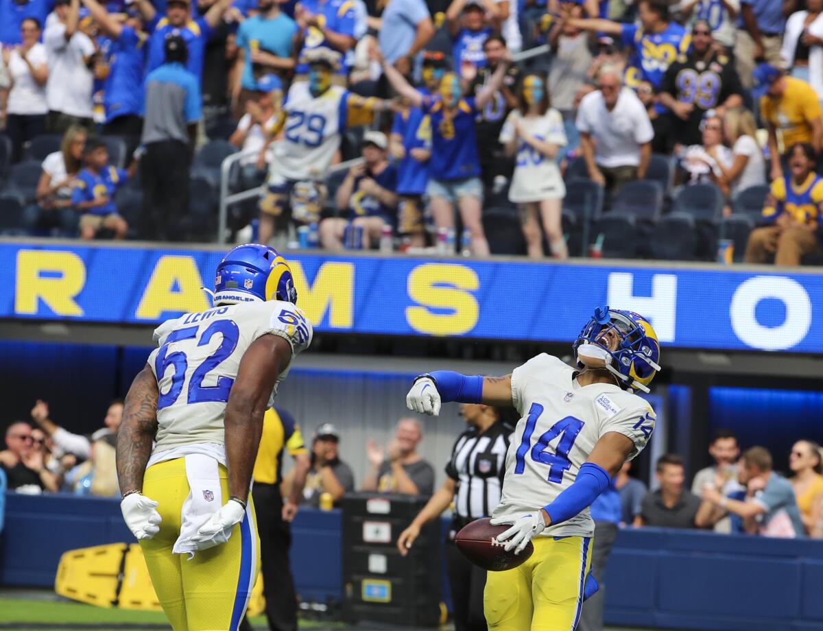 Rams defensive back Cobie Durant, right, celebrates with linebacker Terrell Lewis.