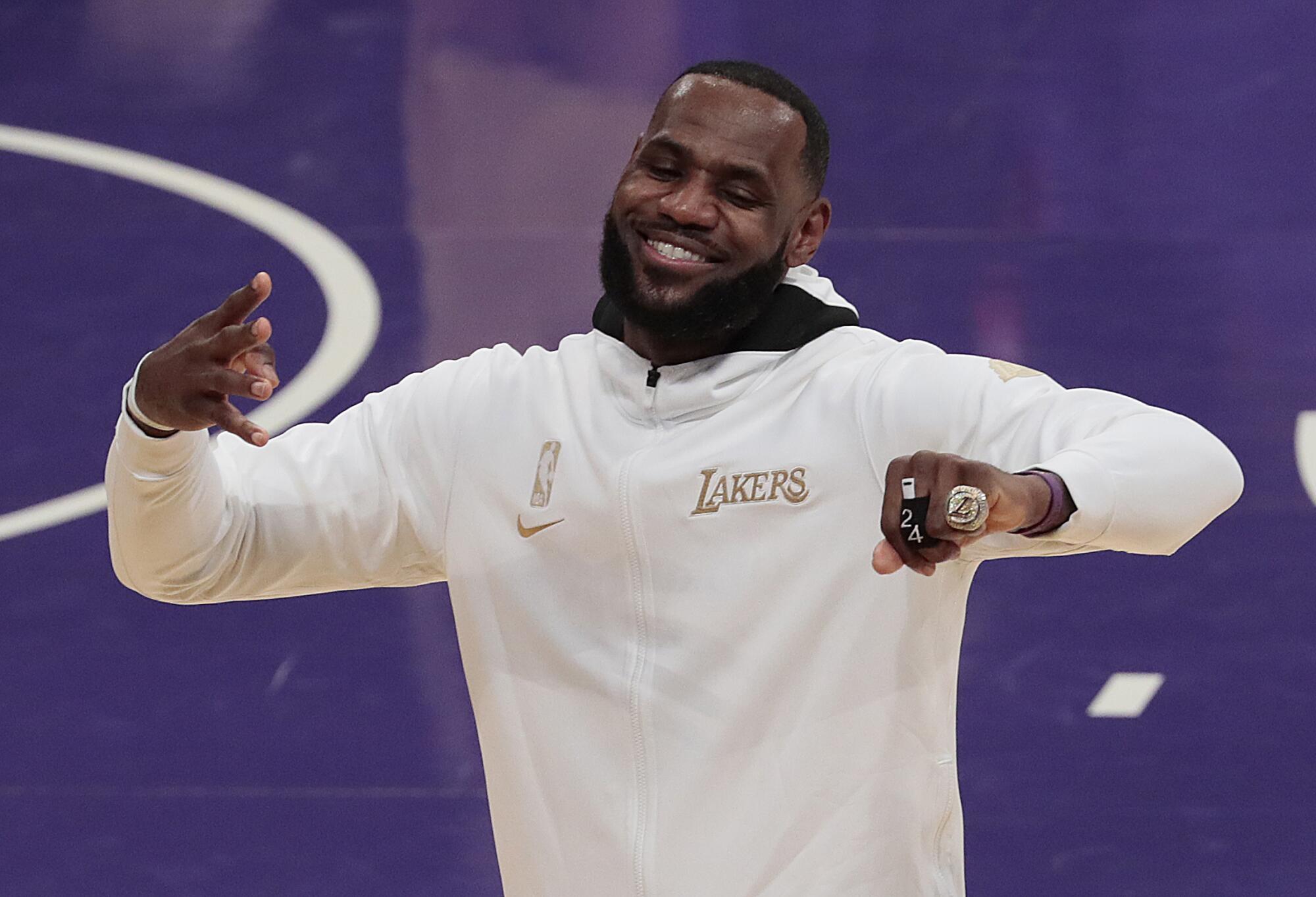 Lakers forward LeBron James celebrates after receiving his 2020 NBA championship ring.