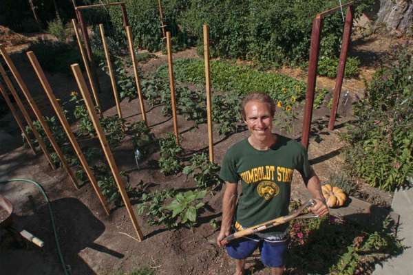 Steven Wynbrandt in his garden, which just three years ago was a barren yard with problematic soil.