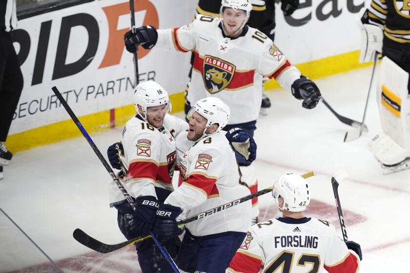 Florida Panthers' Aleksander Barkov (16) celebrates after his goal with Kyle Okposo (8), Gustav Forsling (42) and Vladimir Tarasenko (10) during the third period in Game 4 of an NHL hockey Stanley Cup second-round playoff series against the Boston Bruins, Sunday, May 12, 2024, in Boston. (AP Photo/Michael Dwyer)