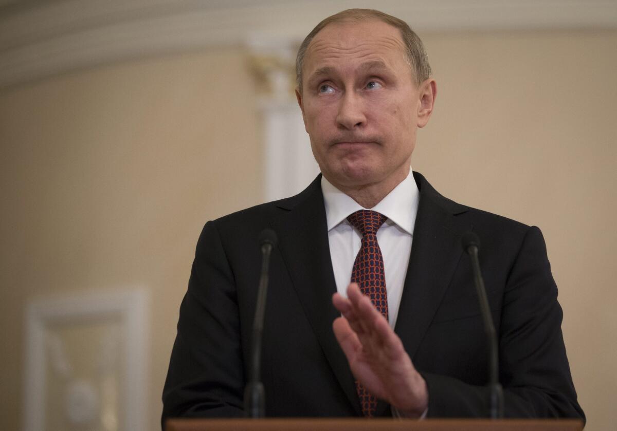 Russian President Vladimir Putin talks to media after the Ukrainian peace negotiations in Minsk, Belarus.