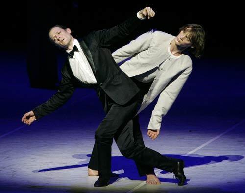 Lloyd Riggins, left, as Gustav von Aschenbach, and Edvin Revazov as Tadzio perform a duet in Hamburg Ballet's presentation of John Neumeier's daring, full-evening story ballet "Death in Venice" at the Orange County Performing Arts Center.