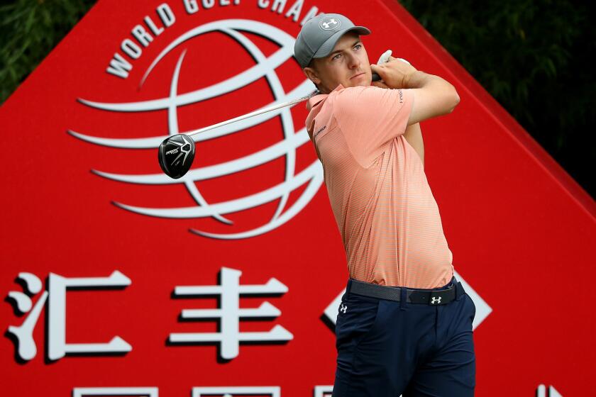 Jordan Spieth follows through on his tee shot at No. 2 during the third round of the HSBC Champions golf tournament Saturday.
