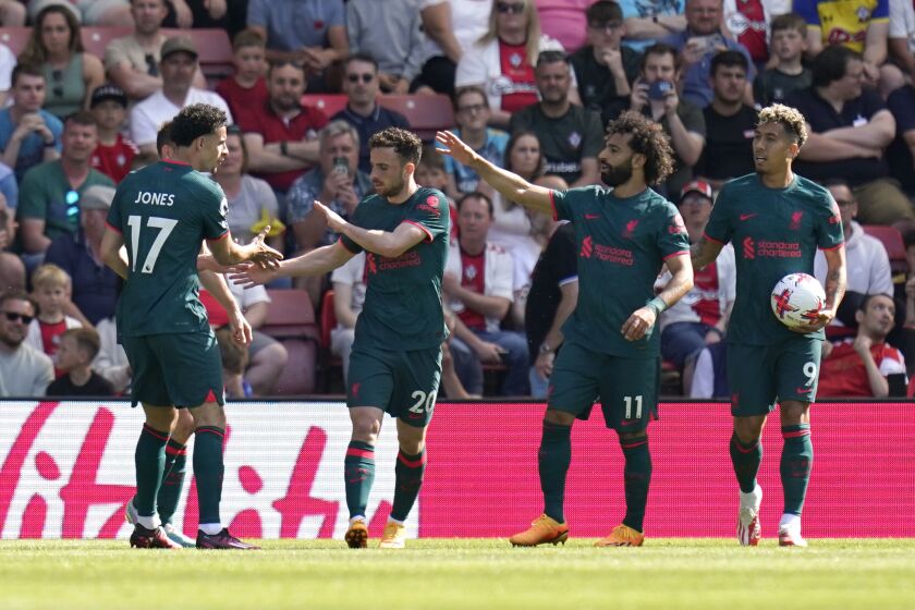 Liverpool's Diogo Jota, center left, celebrates scoring with teammates during the English Premier League soccer match between Liverpool and Southampton at St. Mary's Stadium, Southampton, England, Sunday May 28, 2023. (Andrew Matthews/PA via AP)