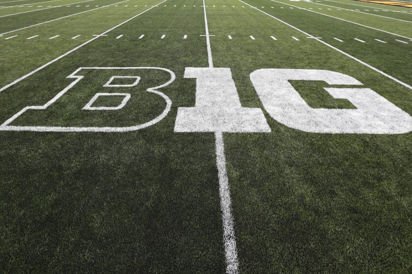 FILE - The Big Ten logo is displayed on the field before an NCAA college football game between Iowa and Miami of Ohio in Iowa City, Iowa., Aug. 31, 2019. History and tradition? Those terms carry no weight in what has essentially become a game of Risk, with the Big Ten and Southeastern Conference taking turns rolling the dice to determine how to divvy up the world of college football. (AP Photo/Charlie Neibergall, File)