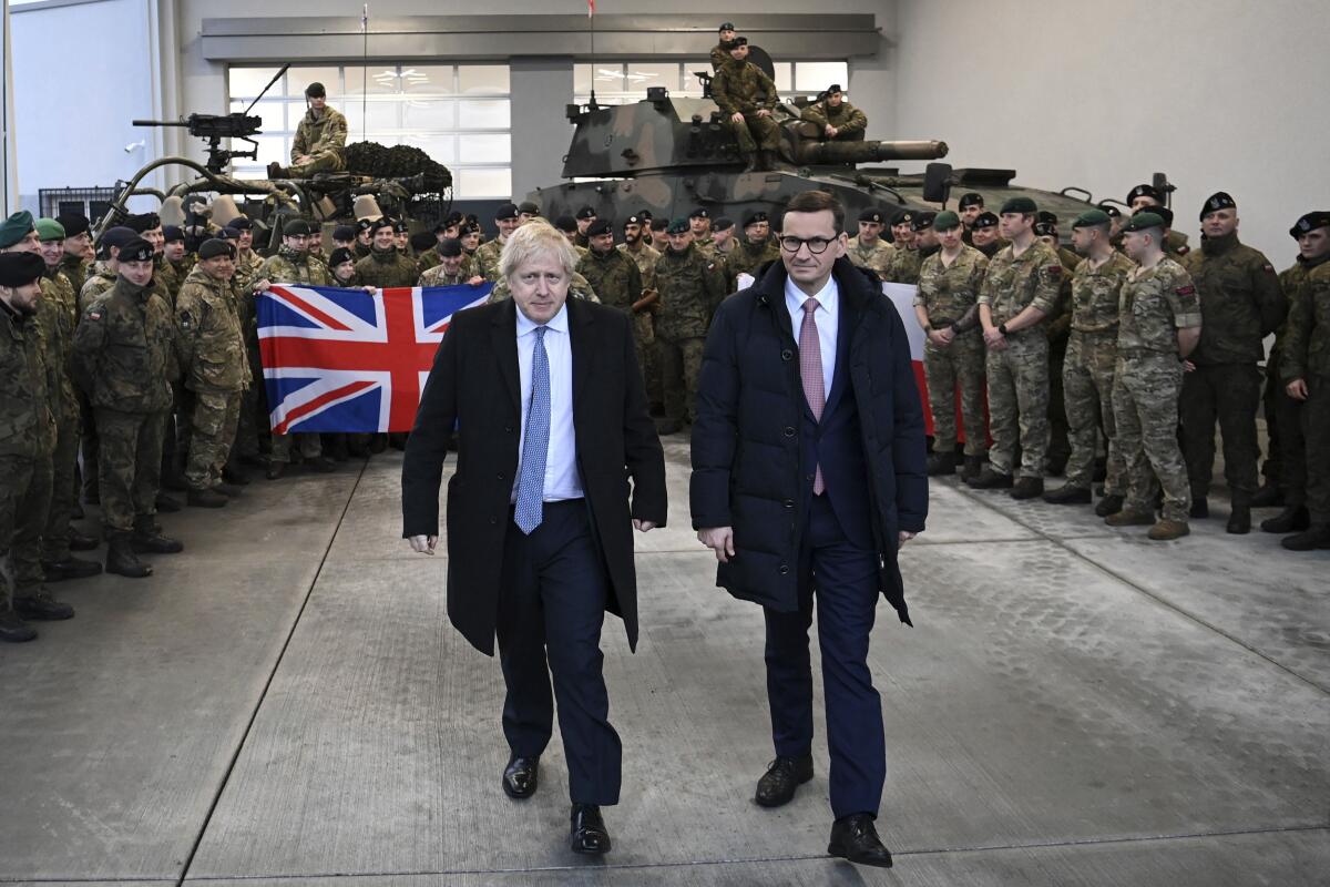 British Prime Minister Boris Johnson, left, and Polish Prime Minister Mateusz Morawiecki 