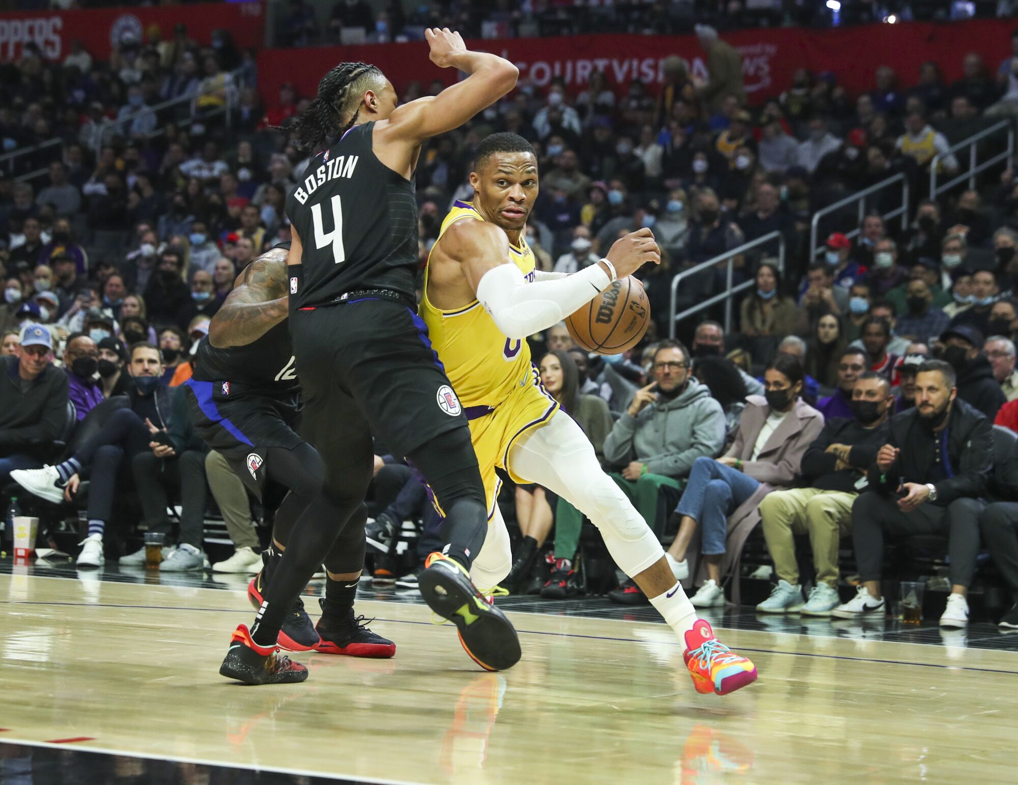 Lakers guard Russell Westbrook drives to the basket against Clippers guard Brandon Boston Jr.