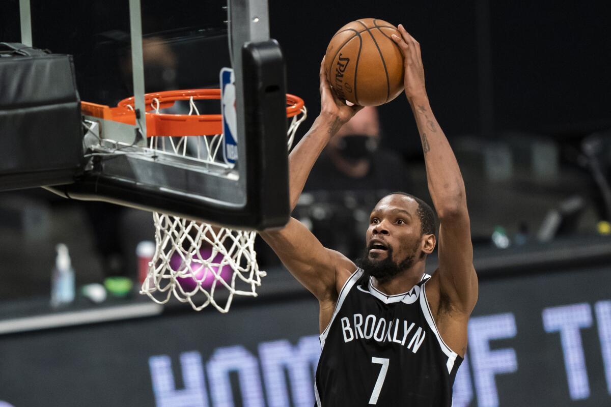 The Nets' Kevin Durant dunks during Game 1 against the Boston Celtics on May 22, 2021, in New York.
