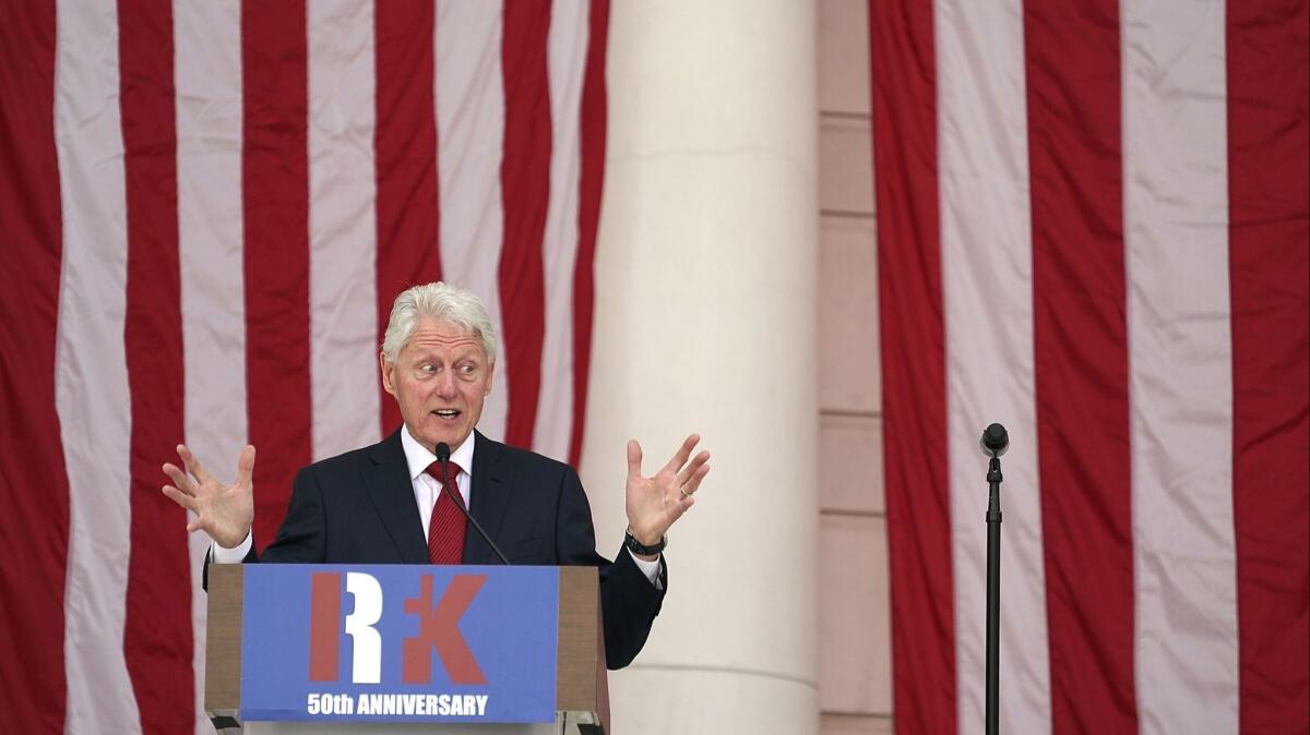 Former President Clinton speaks during a ceremony honoring Robert F. Kennedy to mark the 50th anniversary of his assassination at the Memorial Amphitheater at Arlington National Cemetery in Virginia.