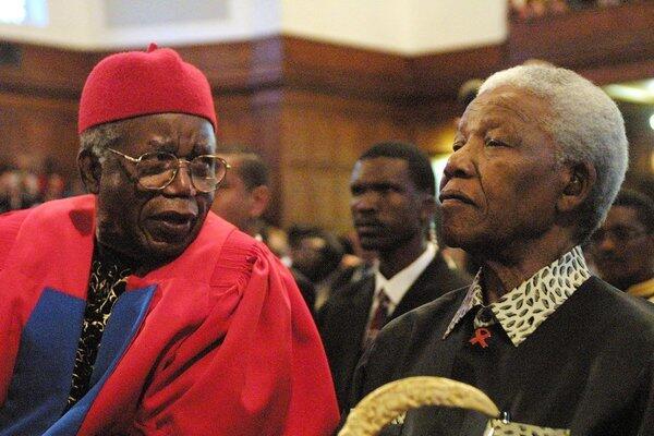 Chinua Achebe, left, Nelson Mandela in South Africa in 2002. Achebe was awarded an honorary degree of doctor of literature and delivered the third Steve Biko Memorial Lecture at the University of Cape Town.