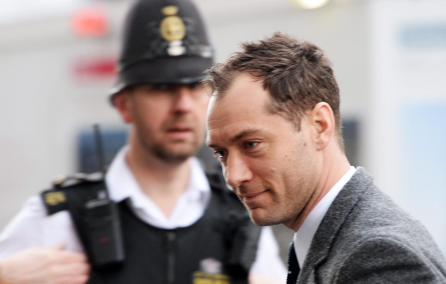 Jude Law arrives at Old Bailey in hacking trial
