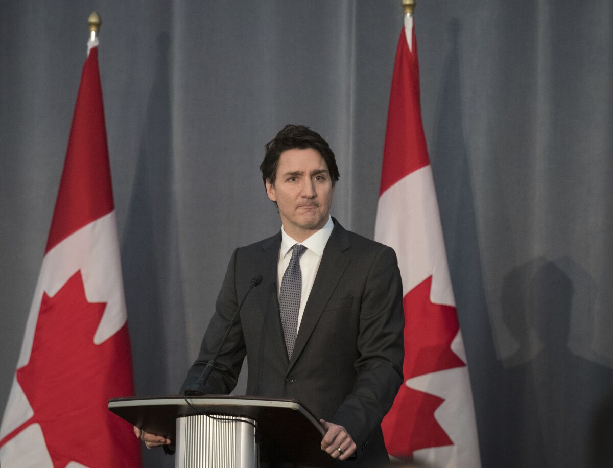 Canadian Prime Minister Justin Trudeau at a podium.
