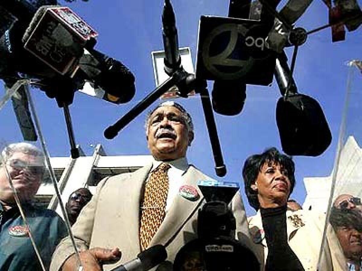 Assemblyman Mervyn Dymally (D-Compton), center, and U.S. Rep. Maxine Waters (D-Los Angeles) hold a news conference at the hospital, where a patient died Thursday.