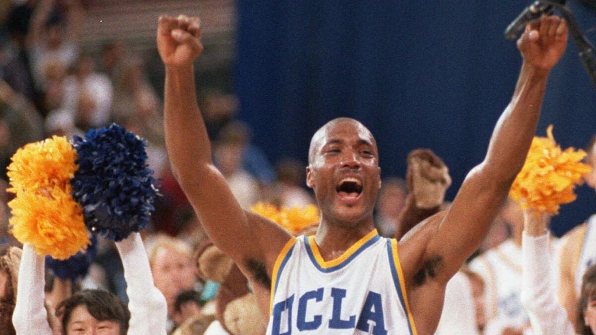 UCLA's Ed O'Bannon celebrates after his team won the NCAA championship in Seattle on April 3, 1995. O'Bannon later sued the NCAA over its use of former student athletes' images without compensation, winning a partial victory.
