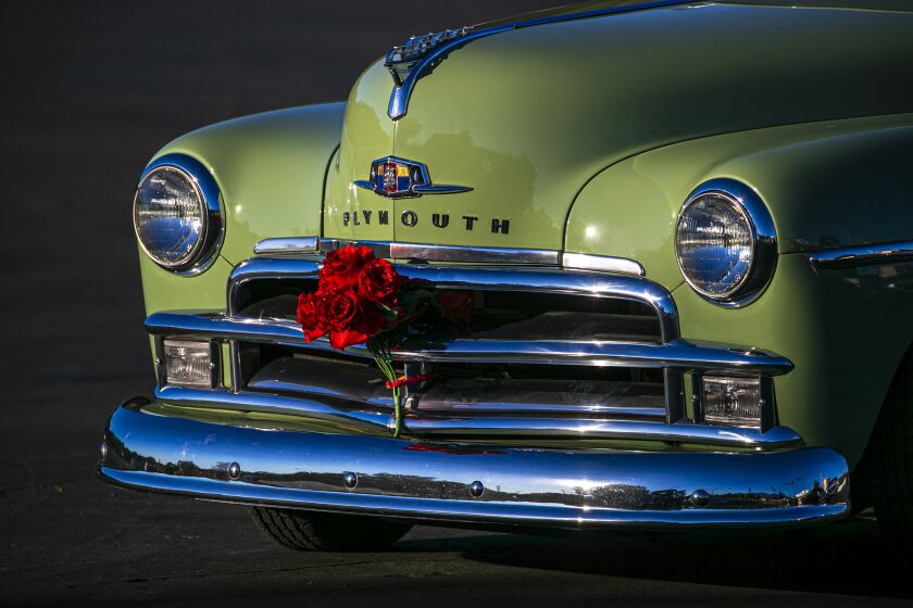 Pasadena, CA - January 01: Sultans Car Club of Long Beach and its friends on a "Rose Parade Cruise" drive along Rose Parade route as it has been cancelled due to COVID-19 pandemic. The Rose Parade Classic Car cruise going through Colorado Blvd. on Friday, Jan. 1, 2021 in Pasadena, CA. (Irfan Khan / Los Angeles Times)