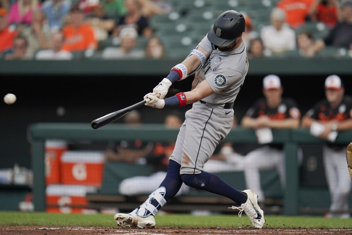 Seattle Mariners' Jesse Winker connects for an RBI single to score Taylor Trammell during the third inning of a baseball game against the Baltimore Orioles, Thursday, June 2, 2022, in Baltimore. (AP Photo/Julio Cortez)