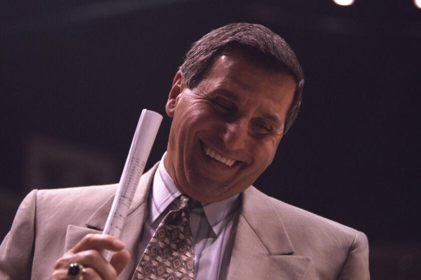 9 Dec 1995: Head coach Jim Harrick of the UCLA Bruins lets out a big smile after his team defeats the Maryland Terrapins at the Wooden Classic at Arrowhead Pond in Anaheim, California. UCLA defeated Maryland 73-63.