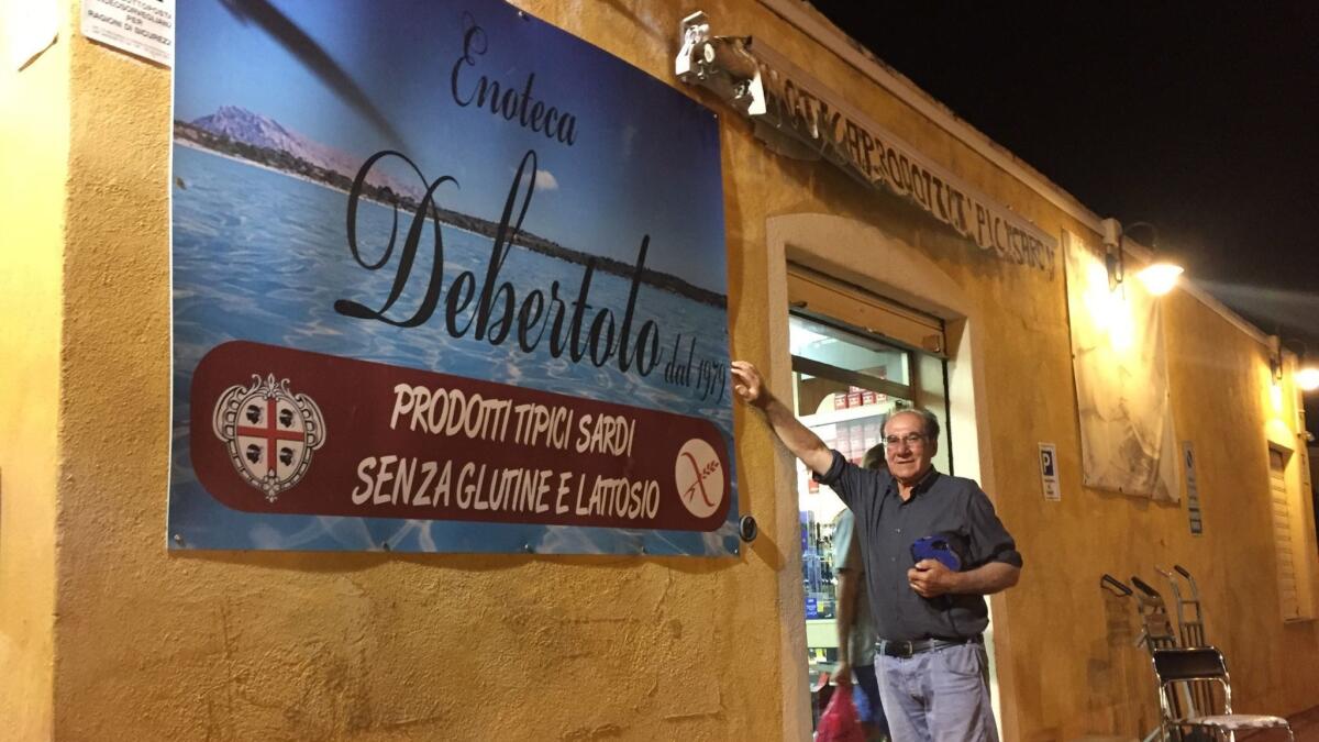 Antonio Debertolo outside his shop in the town of San Teodoro on the island of Sardinia, Italy.