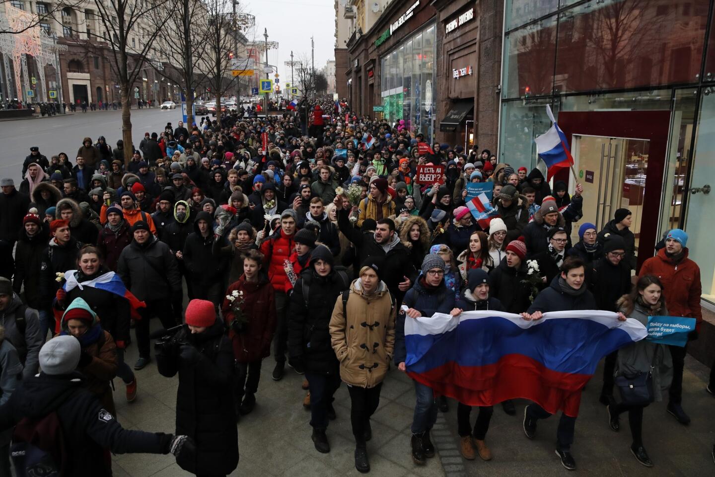 Protesters shout slogans during a rally in Moscow on Jan. 28, 2018, against Russia's Central Election Commission's decision to ban the opposition leader Alexei Navalny presidential candidacy.