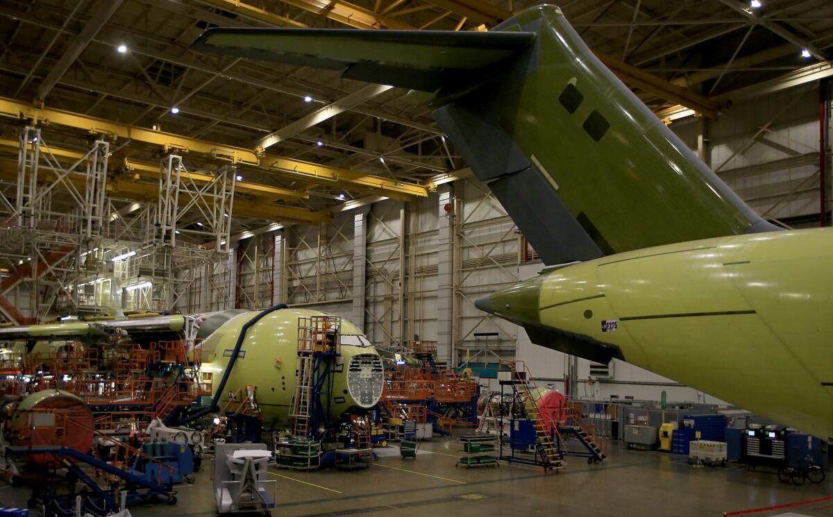 Boeing C-17 military transport planes are completed at the company's sprawling facility in Long Beach.