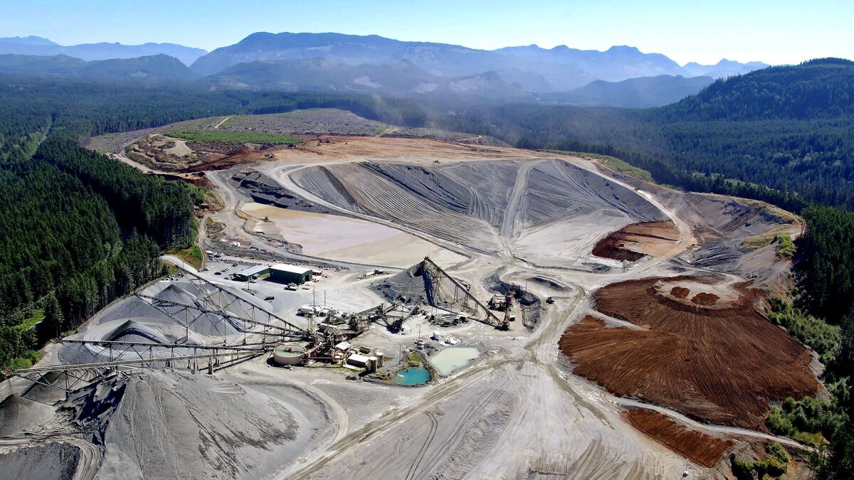 At Polaris Materials' Orca quarry, located on the northern coast of Vancouver Island, gravel and sand are scraped from the sides of the pit.