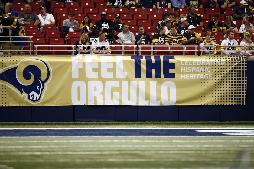 A banner for Hispanic Heritage Month is seen before the start of an NFL football game between the St. Louis Rams and the Pittsburgh Steelers Sunday, Sept. 27, 2015, in St. Louis. (AP Photo/Billy Hurst)