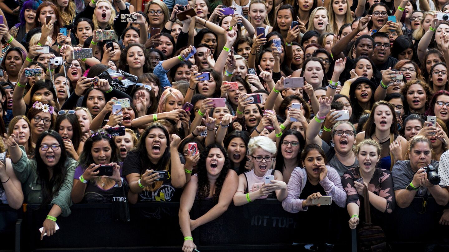 Several thousand fans pack Hollywood & Highland Center for a performance by 5 Seconds of Summer.