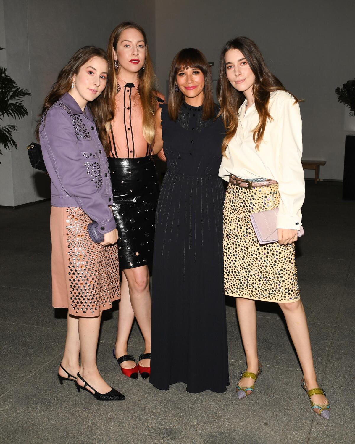 Este Haim, from left, Danielle Haim, Alana Haim, Rashida Jones and Danielle Haim attend the Hammer Museum gala on Saturday.