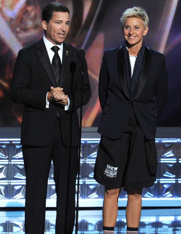 Academy of Television Arts and Sciences Chairman and CEO Bruce Rosenblum, left, takes the stage with a pantless Ellen DeGeneres. DeGeneres gave her pants to Emmy host Jimmy Kimmel in the show's opening sequence.