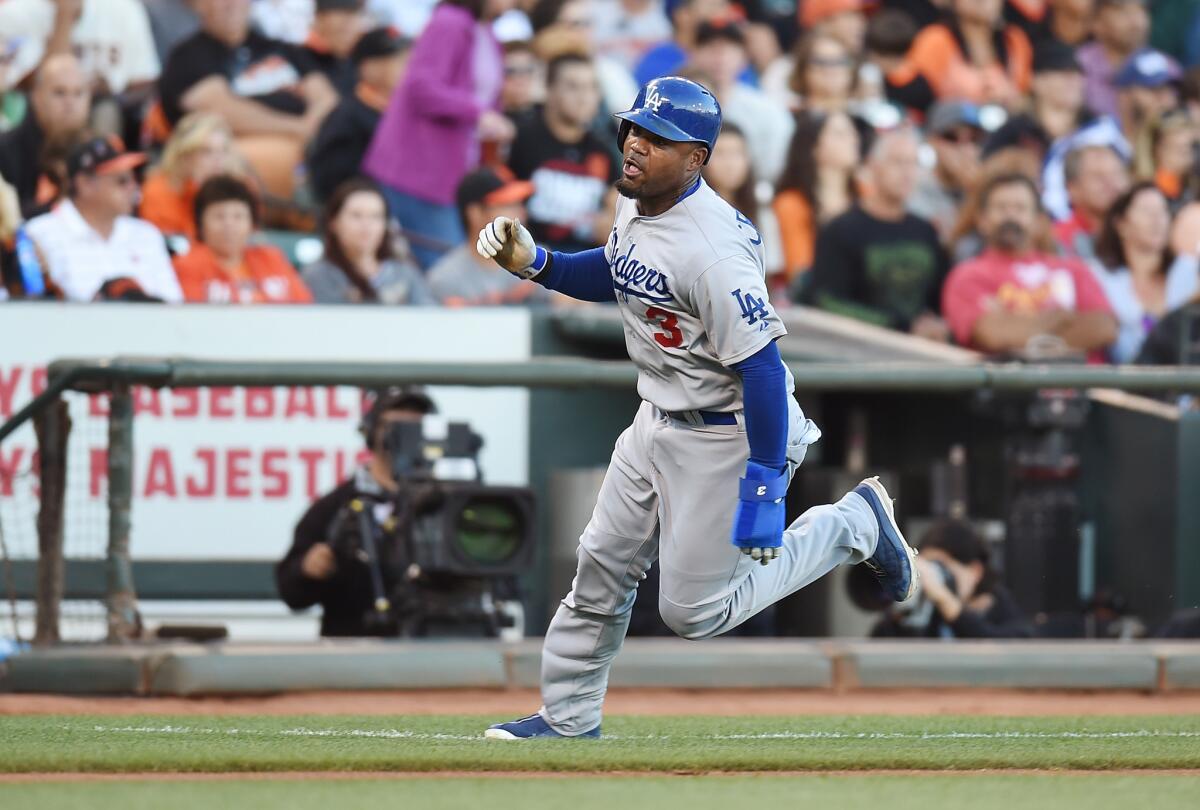 Dodgers' Carl Crawford rounds third base to score in the top of the fifth inning Saturday against San Francisco at AT&T Park.