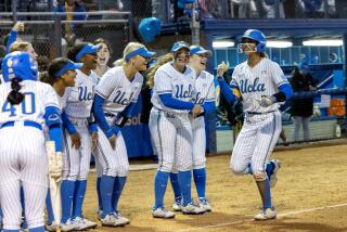 WESTWOOD, CA - MAY 23, 2024: UCLA shortstop Maya Brady (7) is greeted at home plate.