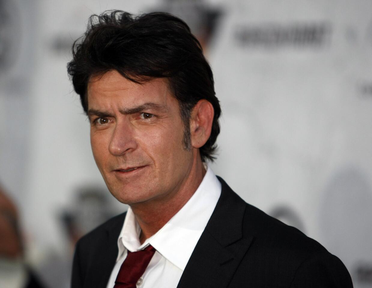 Actor Charlie Sheen, 1996 and 2011