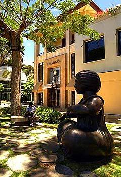 A three-story shopping complex houses Tiffany on Waikikis main street.