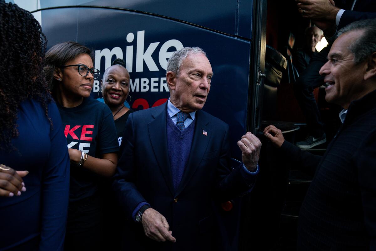 Presidential candidate and former New York Mayor Michael R. Bloomberg talks with former Los Angeles Mayor Antonio Villaraigosa after speaking during a campaign rally at the Douglas F. Dollarhide Community Center in Compton on Feb. 3.