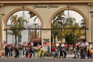 Los Angeles, California-May 4, 2023-On day three of the Writers Guild of America strike, a large group of WGA members picket in front of Paramount Studio gate in Los Angeles, California on May 4, 2023. (Carolyn Cole / Los Angeles Times)