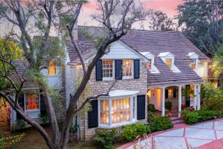 Built in 1937 for $19,800, the Colonial Revival-style home showcases bright colors and a classic Williams-style staircase.