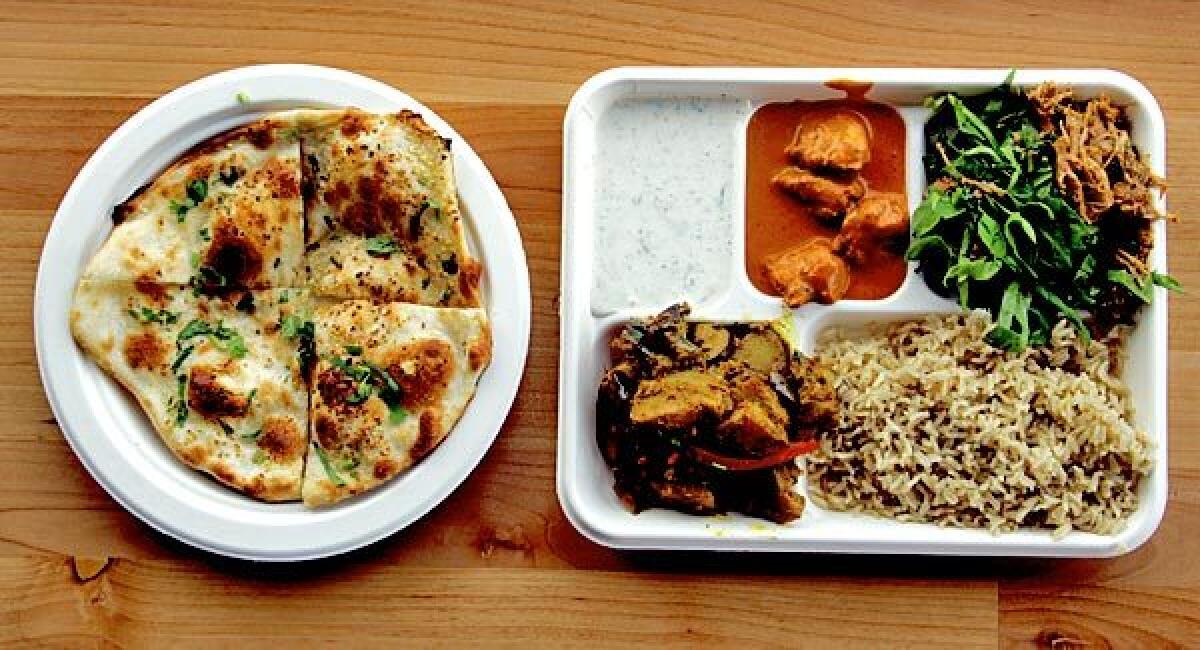 This $7.99 combination plate at the Samosa House includes jack fruit, veggie chicken, eggplant, rice and yogurt salad.