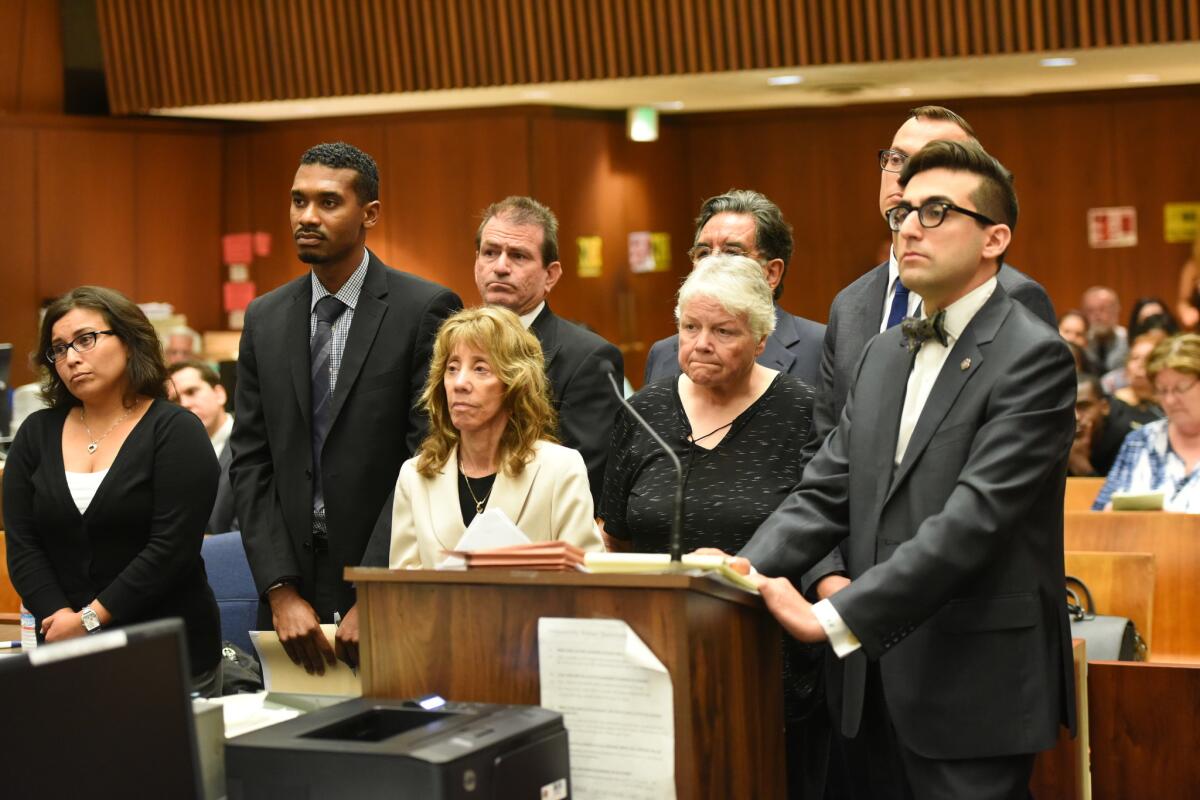 Stefanie Rodriguez, left, Gregory Merritt, fourth from left, Patricia Clement, front-second from right, and Kevin Bom, back-right, were present for their arraignment at the Criminal Courts Building on charges of child abuse and falsifying records.