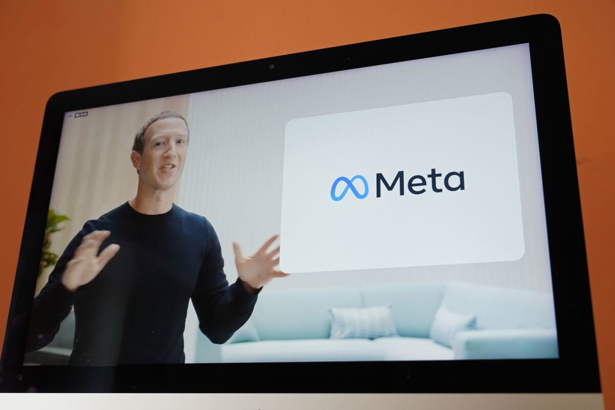 FILE - Seen on the screen of a device in Sausalito, Calif., Facebook CEO Mark Zuckerberg announces the company's new name, Meta, during a virtual event on Thursday, Oct. 28, 2021. Zuckerberg promises that the virtual-reality “metaverse” he’s planning to build will “let you do almost anything.” That might not be such a great idea. (AP Photo/Eric Risberg, File)