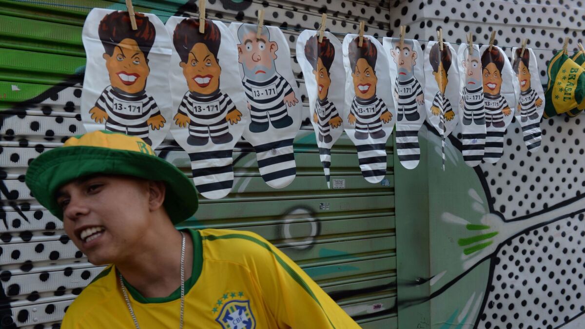 Balloons depicting two former Brazilian presidents, Dilma Rousseff and Luiz Inacio Lula da Silva, are popular items at protests throughout the country. This vendor sells them in Sao Paulo.
