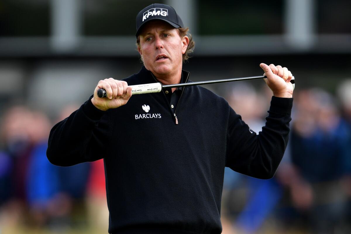 Phil Mickelson reacts after a missed eagle chance during the final round of the British Open.
