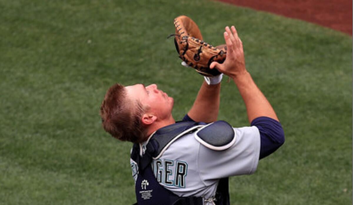 Seattle's Steve Clevenger makes a catch against the Angels on April 23.